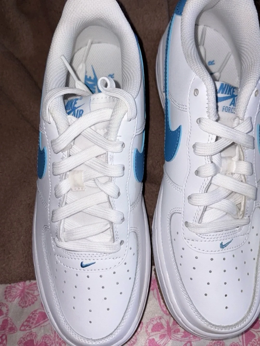 Nike White Sneakers with Blue Swoosh